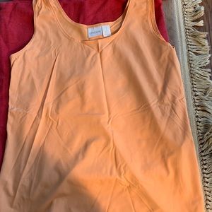 Chico’s size 1 (medium) color is a melon/ orange